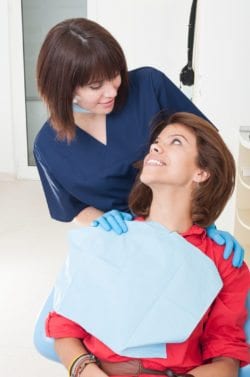 Dentist woman taking good care on her patient