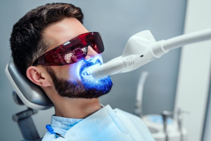 Man undergoing laser whitening treatment dentist in Cohoes New York