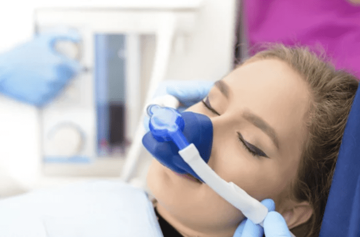 Woman receiving sedation dentistry in office setting dentist in Cohoes New York